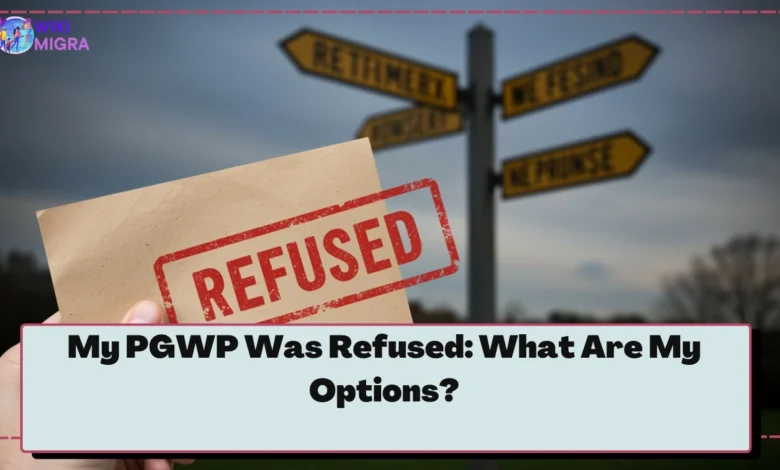 Hand holding a PGWP refusal letter, with diverging paths in background representing options after refusal.